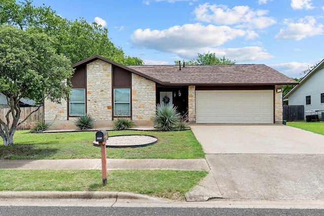 907 Great Oaks Cv, Round Rock, TX 78681 - mid-century inspired home with stone siding, a garage, driveway, and a shingled roof