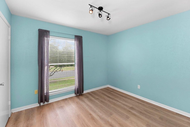 907 Great Oaks Cv, Round Rock, TX 78681 - empty room with wood finished floors and baseboards