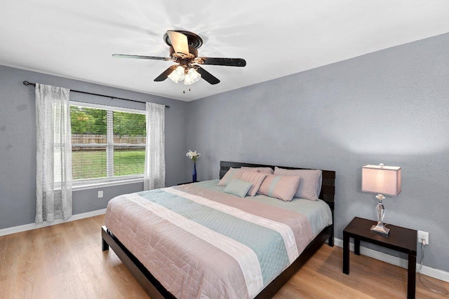 907 Great Oaks Cv, Round Rock, TX 78681 - bedroom with light wood-style flooring and ceiling fan