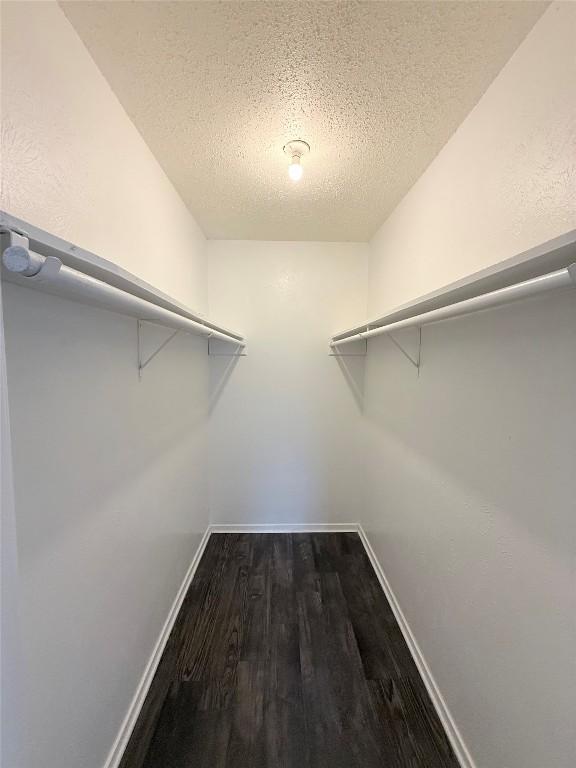 2704 Salado St Unit 207, Austin, TX 78705 - spacious closet with dark wood finished floors