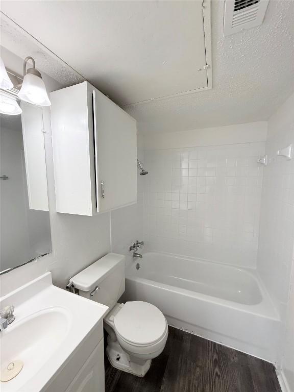 2704 Salado St Unit 207, Austin, TX 78705 - bathroom with wood finished floors, vanity, and shower / bathtub combination