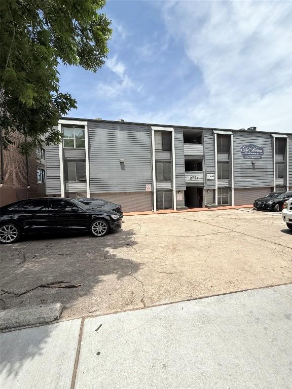 2704 Salado St Unit 207, Austin, TX 78705 - view of property featuring uncovered parking