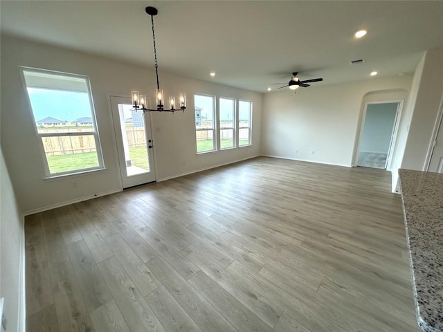 15101 Onager Pass, Manor, TX 78653 - unfurnished dining area with a chandelier, recessed lighting, a ceiling fan, and light wood-type flooring