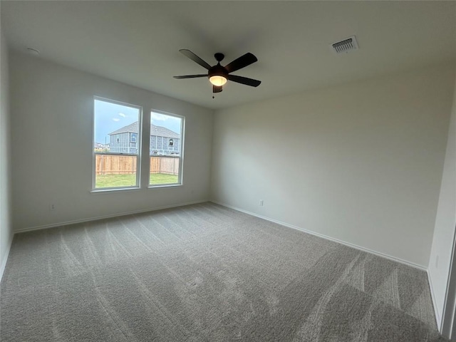 15101 Onager Pass, Manor, TX 78653 - empty room with carpet floors and ceiling fan