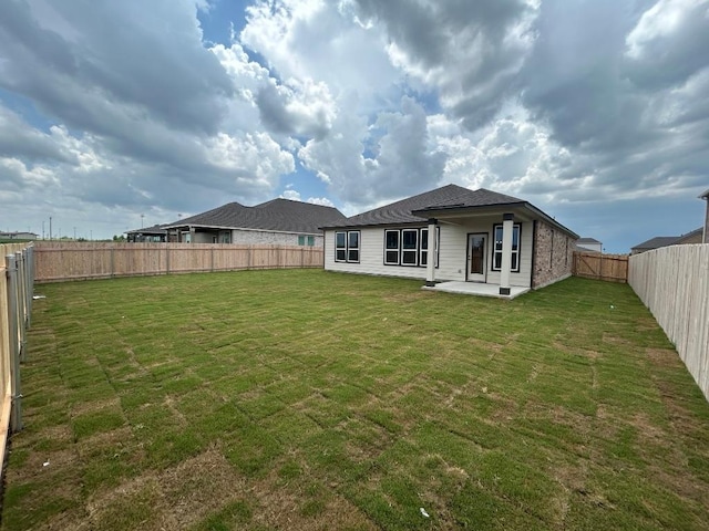 15101 Onager Pass, Manor, TX 78653 - back of house featuring a patio and a fenced backyard