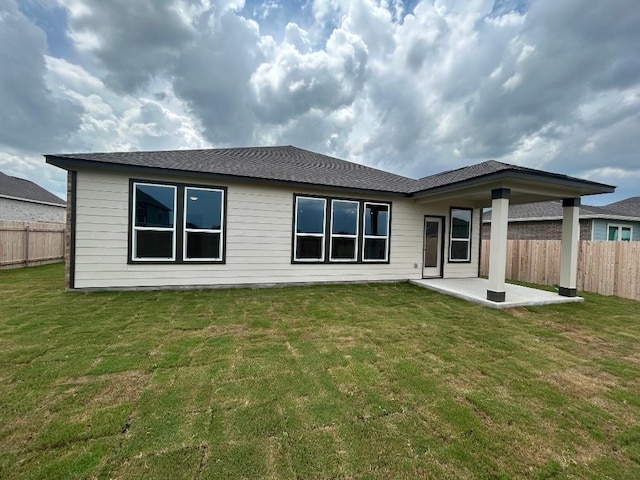 15101 Onager Pass, Manor, TX 78653 - rear view of property featuring a patio