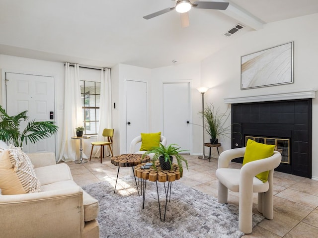 12919 Margit Dr, Austin, TX 78729 - living area with a ceiling fan, a tiled fireplace, and light tile patterned floors