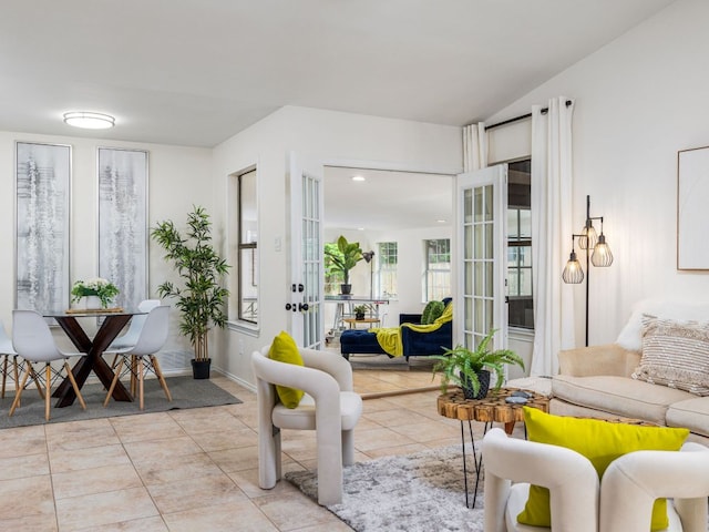 12919 Margit Dr, Austin, TX 78729 - living room with light tile patterned flooring, french doors, and recessed lighting