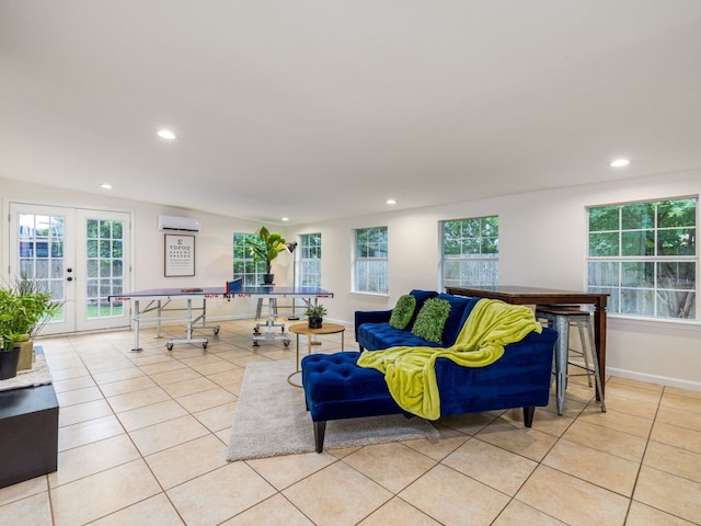 12919 Margit Dr, Austin, TX 78729 - living area featuring a wall mounted AC, light tile patterned floors, recessed lighting, french doors, and plenty of natural light
