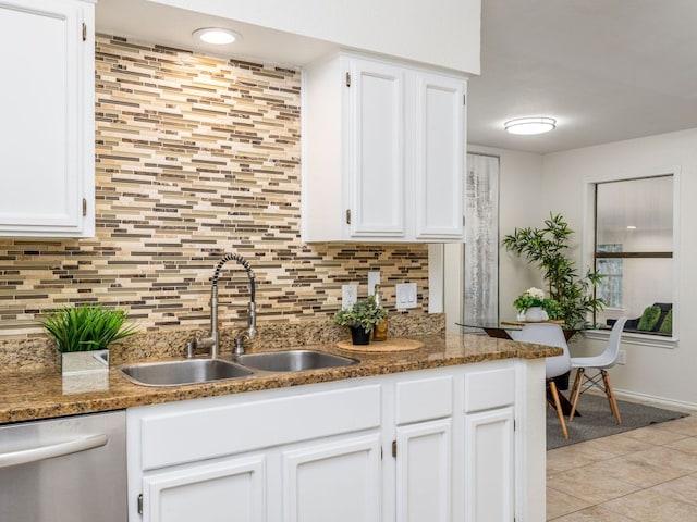 12919 Margit Dr, Austin, TX 78729 - kitchen with dishwasher, white cabinetry, decorative backsplash, and light tile patterned flooring