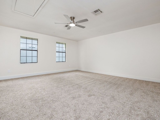 12919 Margit Dr, Austin, TX 78729 - unfurnished room with a ceiling fan, carpet, and attic access