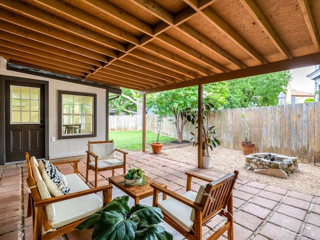 12919 Margit Dr, Austin, TX 78729 - fenced backyard featuring a patio and an outdoor living space with a fire pit