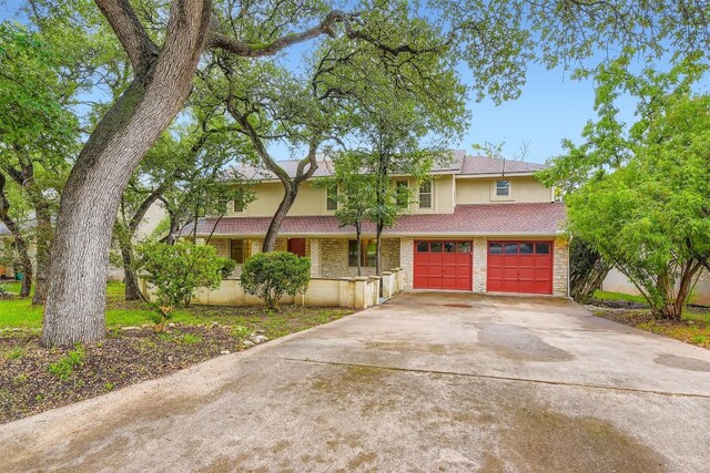 6819 Bayridge Ter, Austin, TX 78759 - view of front facade featuring driveway, stucco siding, and a garage