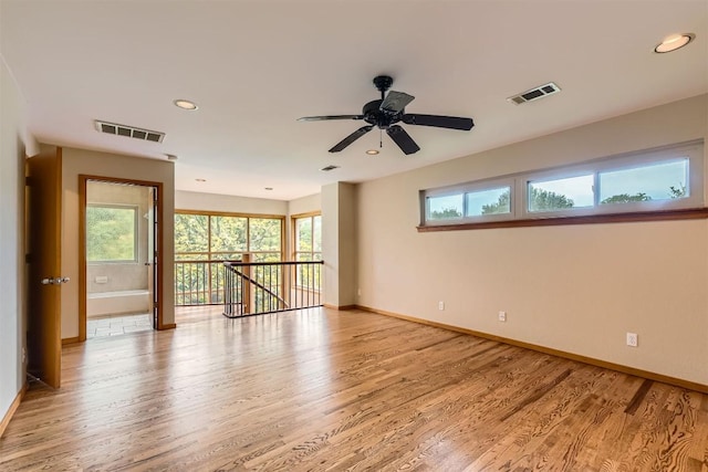 6819 Bayridge Ter, Austin, TX 78759 - empty room with light wood-style flooring, ceiling fan, and recessed lighting