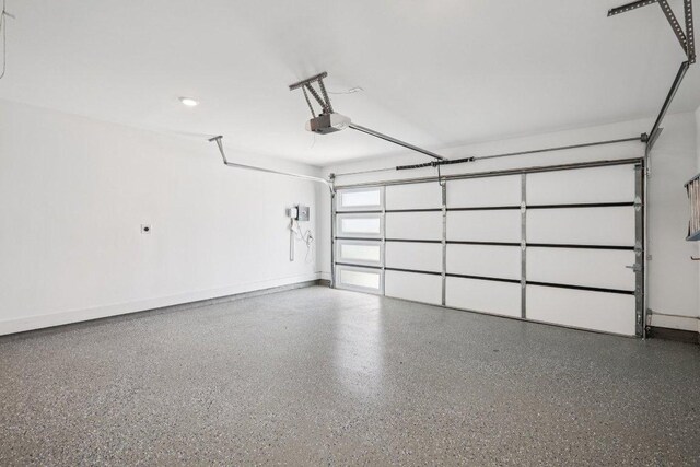 412 Pin Cherry Pass, San Marcos, TX 78666 - garage with a garage door opener and baseboards