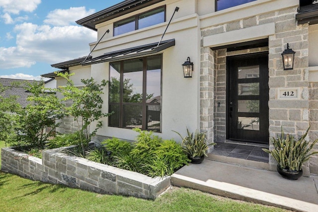 412 Pin Cherry Pass, San Marcos, TX 78666 - doorway to property with stucco siding and stone siding