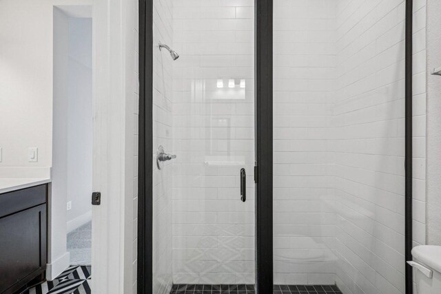 412 Pin Cherry Pass, San Marcos, TX 78666 - bathroom featuring a stall shower and vanity