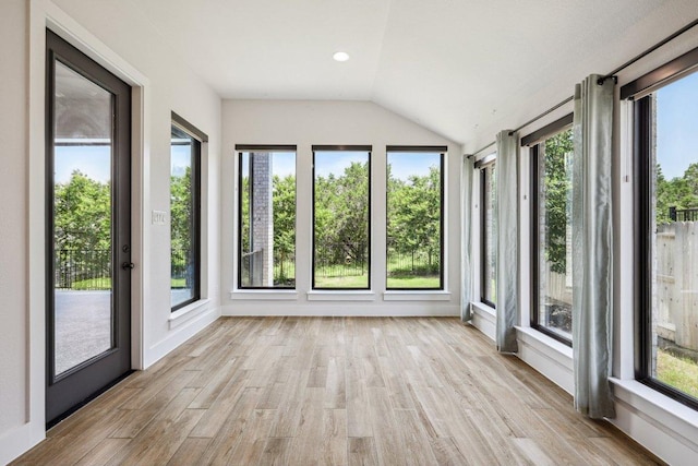 412 Pin Cherry Pass, San Marcos, TX 78666 - unfurnished sunroom featuring plenty of natural light, lofted ceiling, and wood finished floors