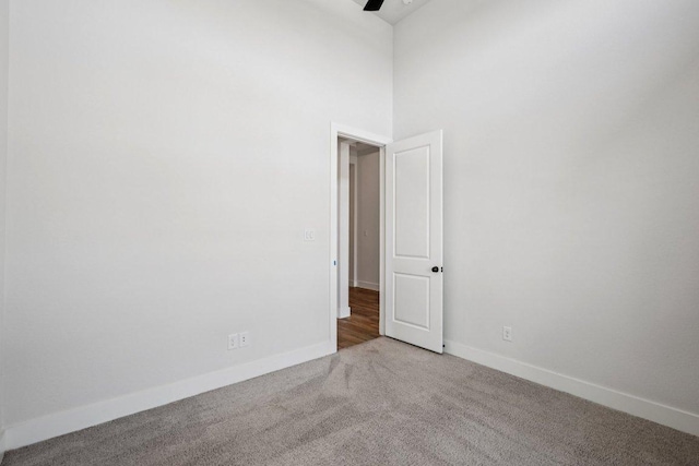 412 Pin Cherry Pass, San Marcos, TX 78666 - carpeted spare room with ceiling fan and a towering ceiling