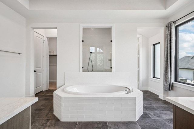 412 Pin Cherry Pass, San Marcos, TX 78666 - bathroom with a garden tub, vanity, and a tile shower
