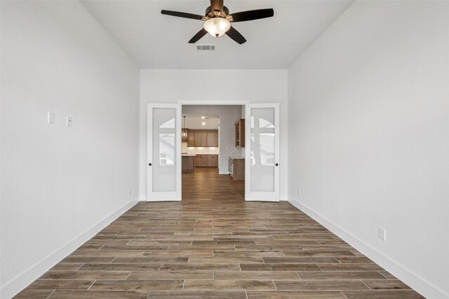 412 Pin Cherry Pass, San Marcos, TX 78666 - empty room featuring ceiling fan and wood finished floors