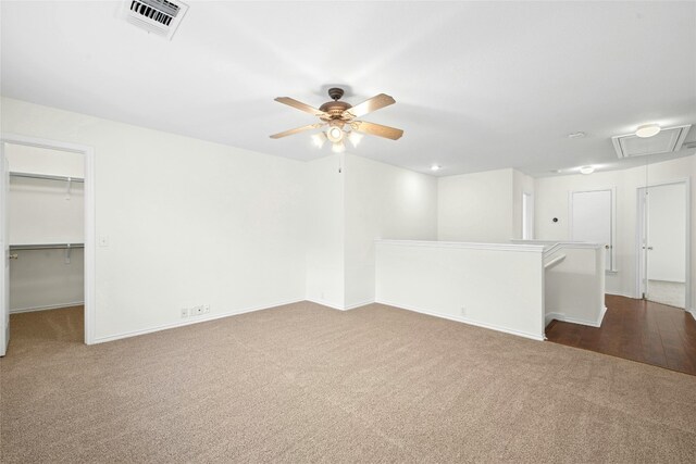 11024 Mint Julep Dr, Austin, TX 78748 - unfurnished living room with attic access, carpet, and a ceiling fan