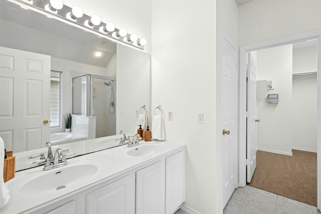 11024 Mint Julep Dr, Austin, TX 78748 - bathroom featuring a shower stall, double vanity, a garden tub, and tile patterned flooring