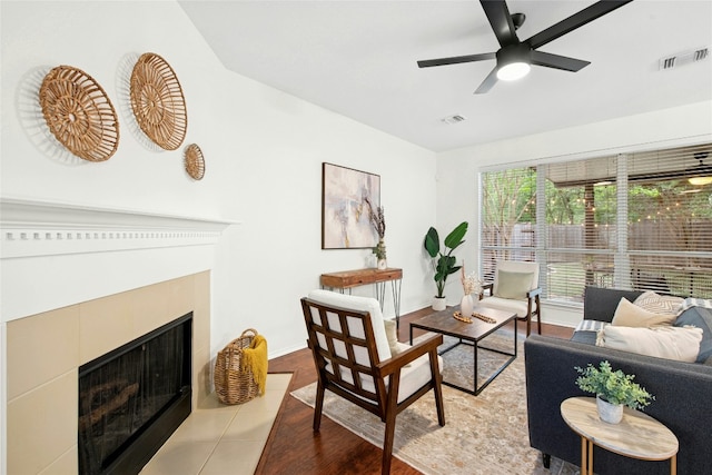 11024 Mint Julep Dr, Austin, TX 78748 - living area featuring a fireplace with flush hearth, ceiling fan, and tile patterned flooring