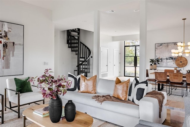 3901 Peak Lookout Dr, Austin, TX 78738 - living area featuring stairway, wood finished floors, and a chandelier