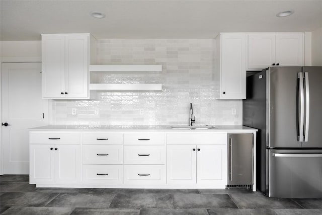 3901 Peak Lookout Dr, Austin, TX 78738 - kitchen featuring freestanding refrigerator, open shelves, and white cabinets