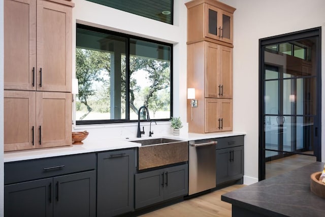 439 Junker Hl, Fredericksburg, TX 78624 - bar featuring stainless steel dishwasher, healthy amount of natural light, and light wood finished floors