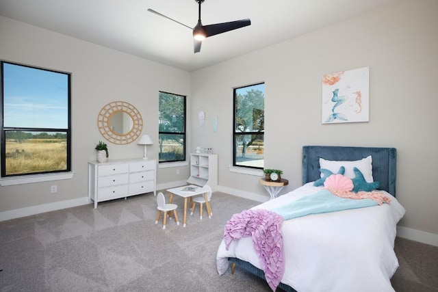 439 Junker Hl, Fredericksburg, TX 78624 - carpeted bedroom with baseboards and ceiling fan