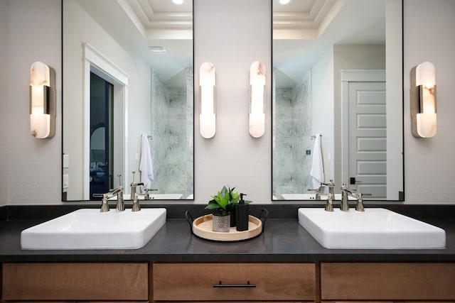 439 Junker Hl, Fredericksburg, TX 78624 - full bath with double vanity, crown molding, a raised ceiling, and recessed lighting