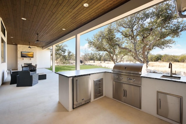 439 Junker Hl, Fredericksburg, TX 78624 - view of patio / terrace with an outdoor kitchen and an outdoor hangout area