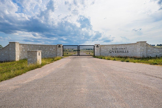 439 Junker Hl, Fredericksburg, TX 78624 - view of asphalt road with a gate