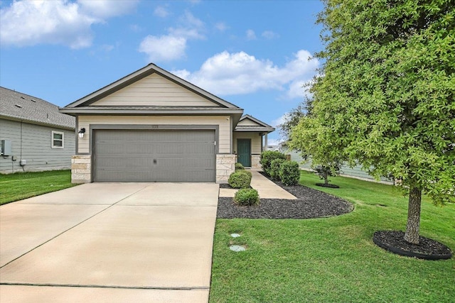 132 Ancellotta Way, Leander, TX 78641 - view of front facade featuring driveway, a front yard, an attached garage, and stone siding