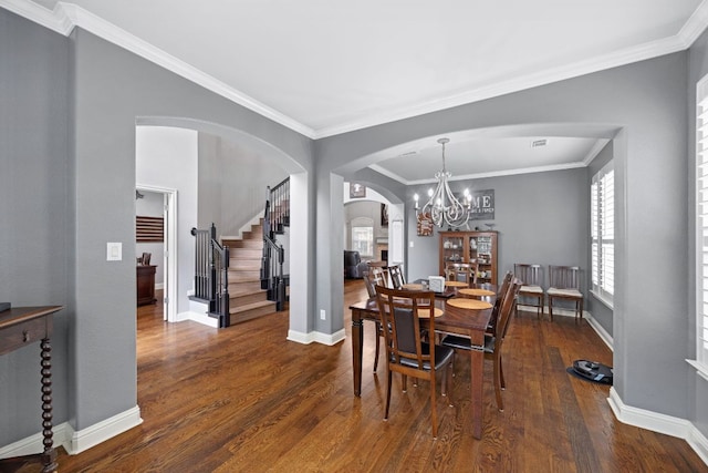 15413 Echo Hills Dr, Austin, TX 78717 - dining area with arched walkways, stairway, dark wood-style floors, a chandelier, and ornamental molding