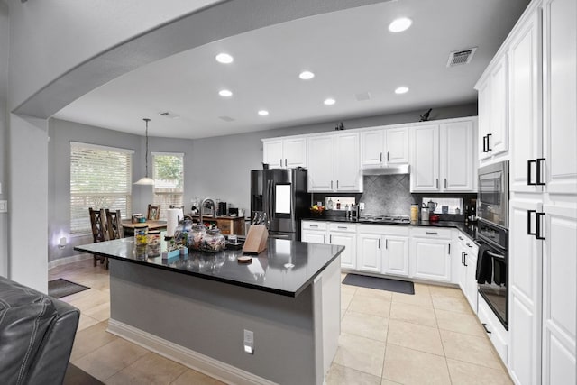 15413 Echo Hills Dr, Austin, TX 78717 - kitchen with appliances with stainless steel finishes, dark countertops, recessed lighting, decorative backsplash, and white cabinets