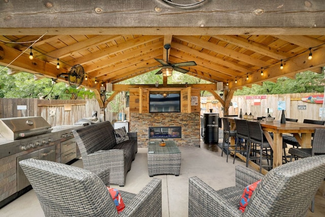 15413 Echo Hills Dr, Austin, TX 78717 - view of patio with a gazebo, an outdoor kitchen, an outdoor living space with a fireplace, and a ceiling fan