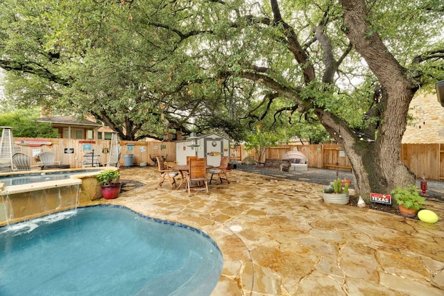 15413 Echo Hills Dr, Austin, TX 78717 - view of pool with a storage shed, a fenced backyard, outdoor dining area, and a patio area