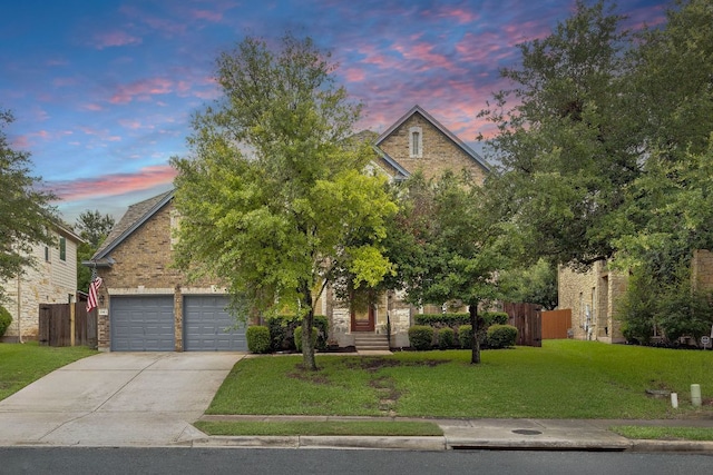 15413 Echo Hills Dr, Austin, TX 78717 - obstructed view of property with concrete driveway, stone siding, and a garage