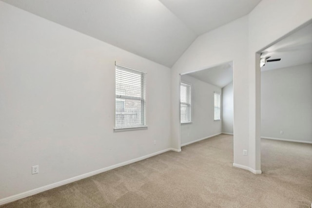 2344 Broken Wagon Dr, Leander, TX 78641 - spare room with light carpet, vaulted ceiling, and a ceiling fan