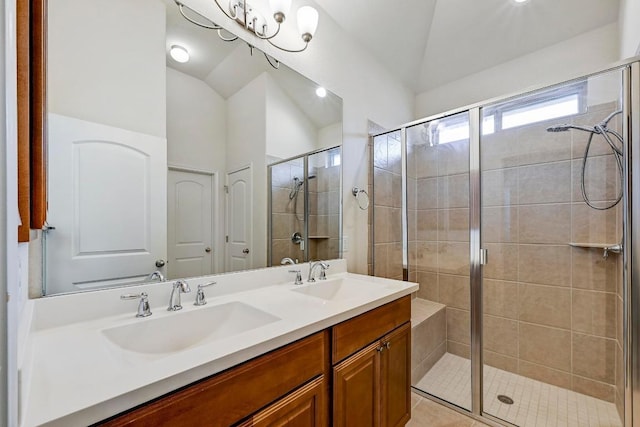 2344 Broken Wagon Dr, Leander, TX 78641 - bathroom with vaulted ceiling, a stall shower, and double vanity