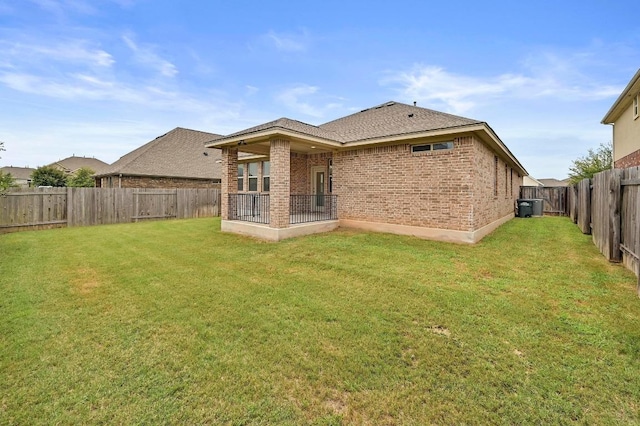 2344 Broken Wagon Dr, Leander, TX 78641 - back of house featuring brick siding and a fenced backyard
