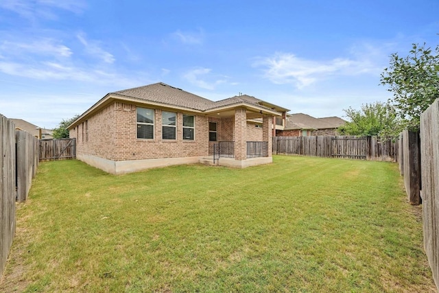 2344 Broken Wagon Dr, Leander, TX 78641 - back of house featuring brick siding and a fenced backyard