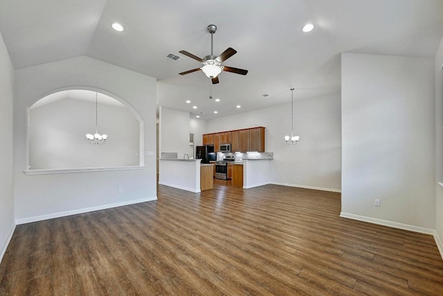 2344 Broken Wagon Dr, Leander, TX 78641 - unfurnished living room with a chandelier, lofted ceiling, a ceiling fan, dark wood-style flooring, and recessed lighting