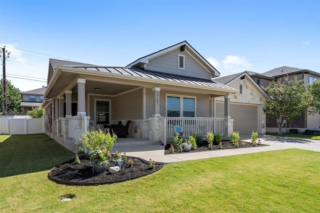 19105 Obed River Dr, Pflugerville, TX 78660 - view of front facade featuring a standing seam roof, an attached garage, covered porch, driveway, and a metal roof