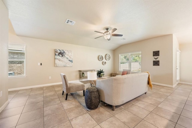 19105 Obed River Dr, Pflugerville, TX 78660 - living area featuring a ceiling fan, light tile patterned flooring, and vaulted ceiling