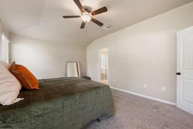 19105 Obed River Dr, Pflugerville, TX 78660 - carpeted bedroom featuring vaulted ceiling, connected bathroom, and a ceiling fan