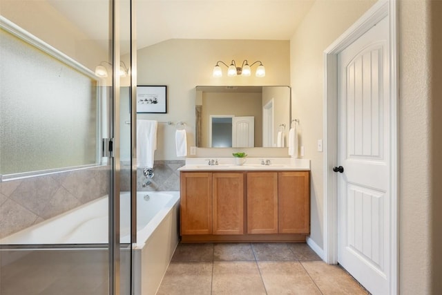 19105 Obed River Dr, Pflugerville, TX 78660 - full bath featuring double vanity, a bath, lofted ceiling, and tile patterned flooring
